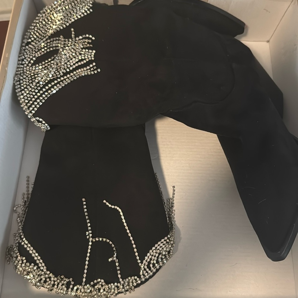 Black suede boots with silver tassels